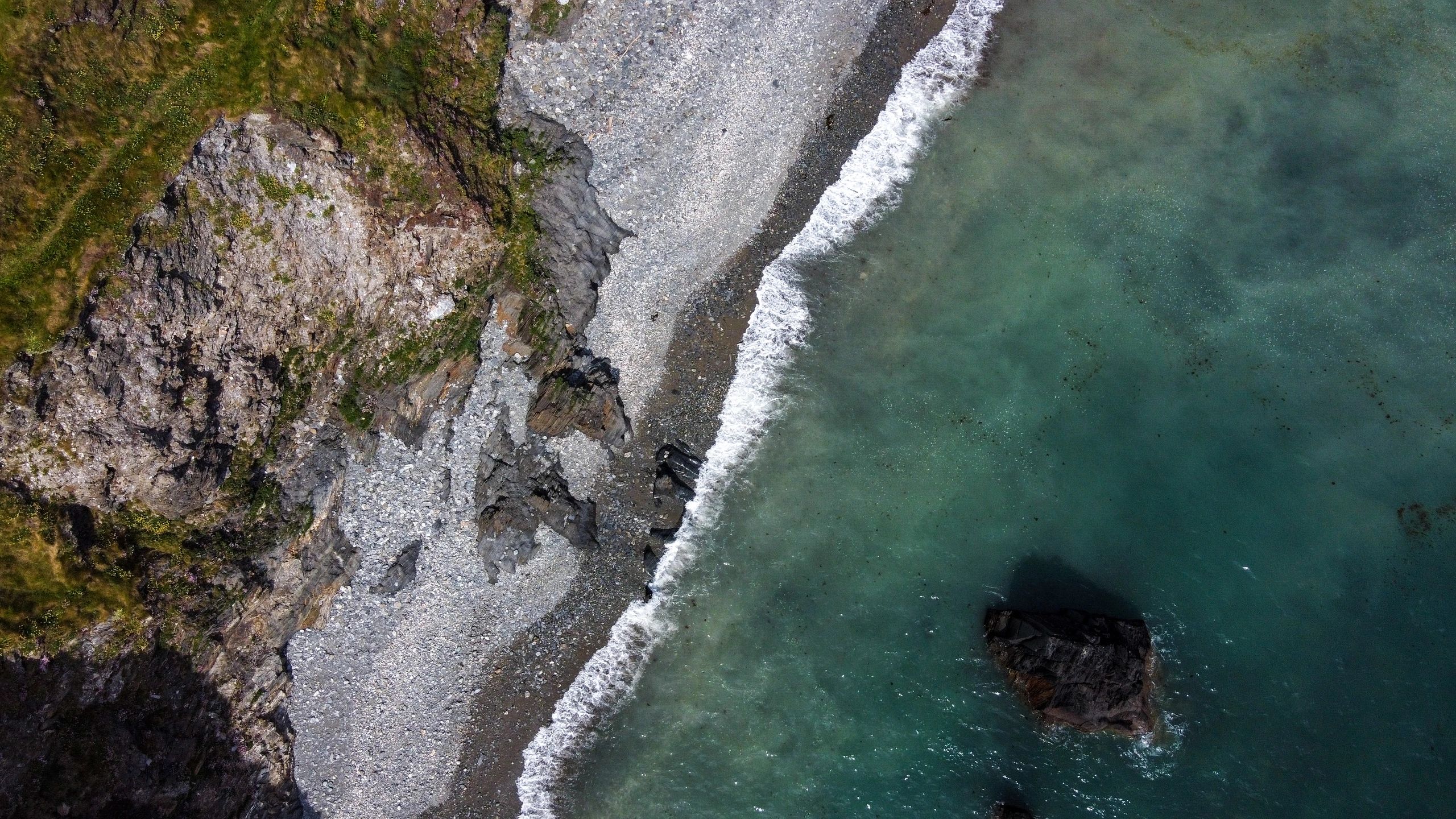 Rocky coastline and sea representing Alderney nature