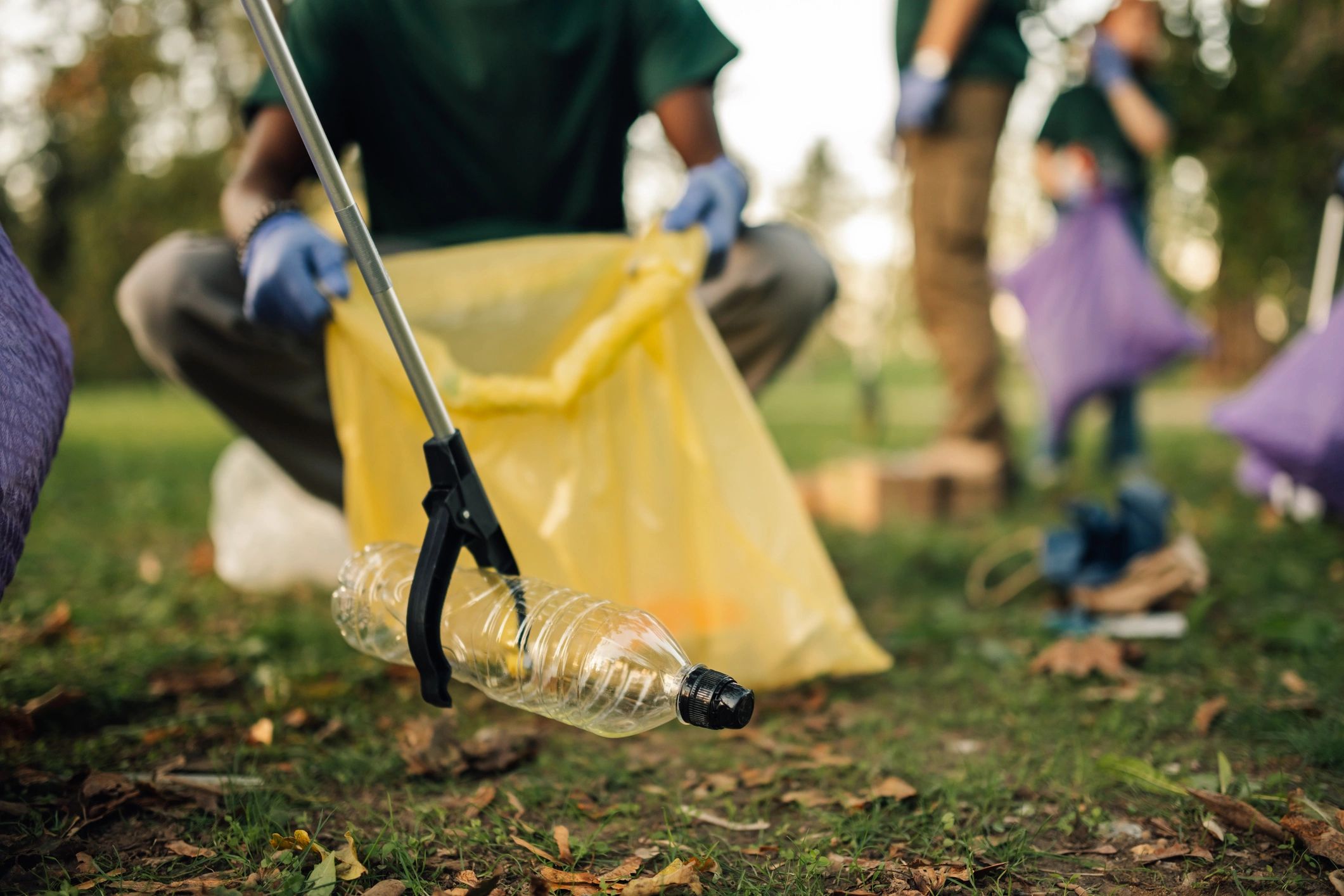 Volunteer collecting litter during a community cleanup